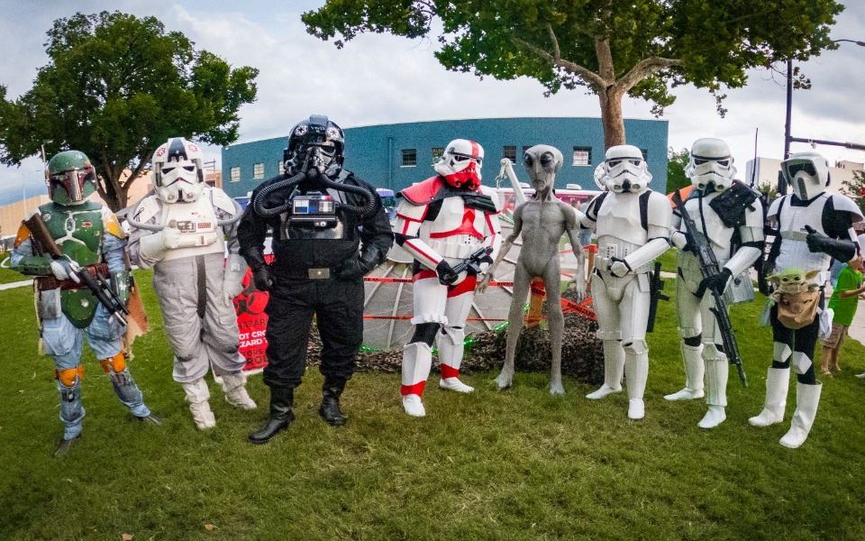 501st Dewback Ridge Legion members posed with MainStreet Roswell's alien statues at the UFO Festival in Roswell, New Mexico.