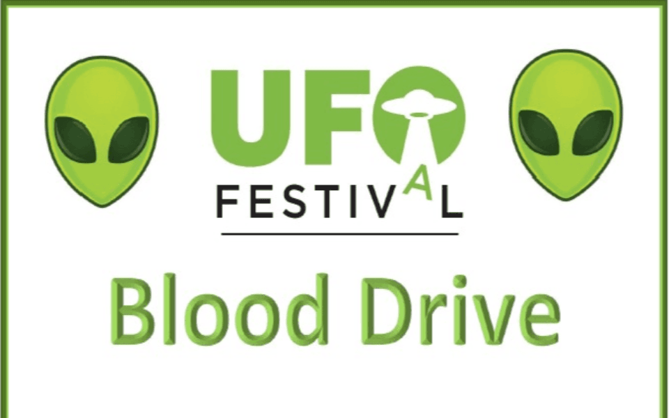 Two aliens and text for a blood drive at the 2024 UFO Festival.