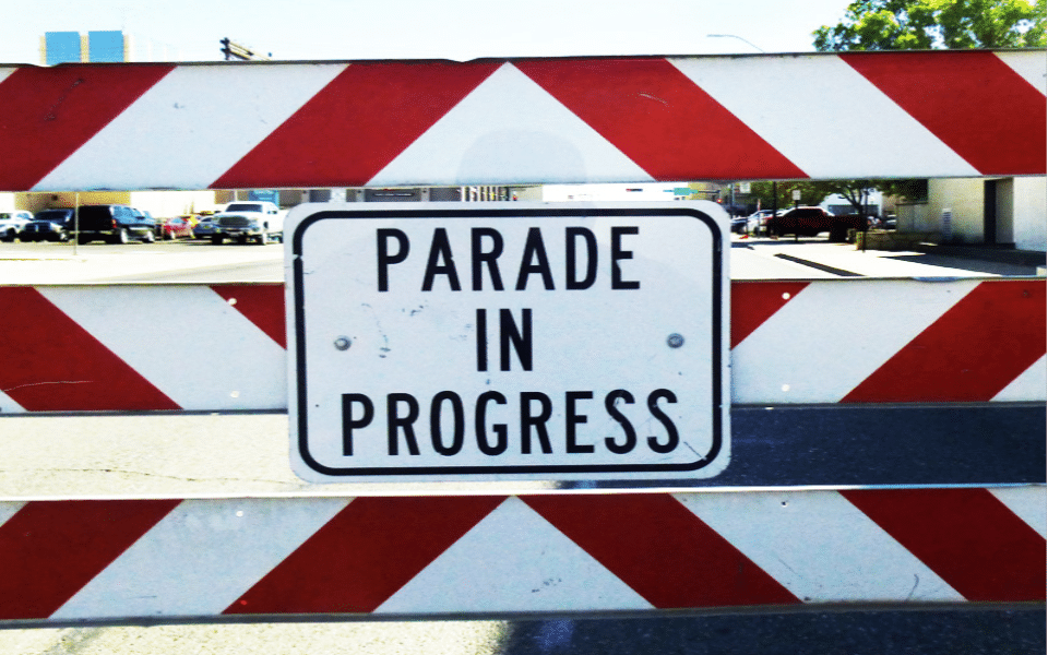 A barcade that reads, "Parade in Progress." An event picture for the 2024 ENMSF Parade.